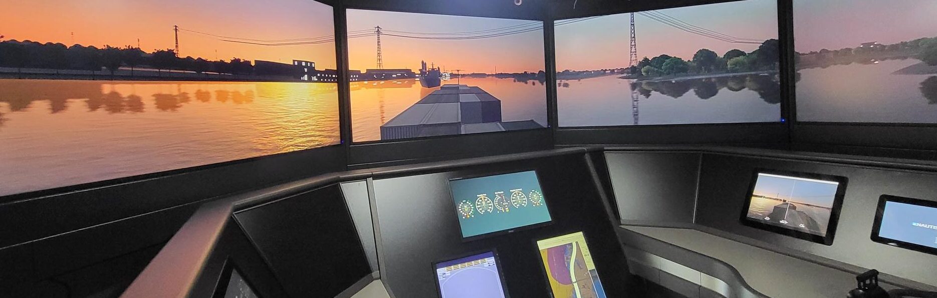 NAUTIS inland simulator bridge with a river scene on the visual screens